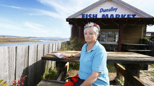 Bream Creek resident Joan Ward, pictured at the Dunalley Fish Market, is among those angered by an increase in flights over the area. Picture: MATT THOMPSON