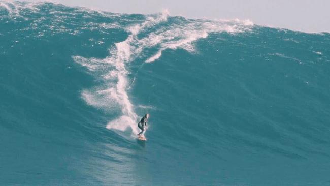 Felicity Palmateer becomes the first female to ride a monster wave at Cow Bombie off Gracetown. Pic: Nimai Strickland.