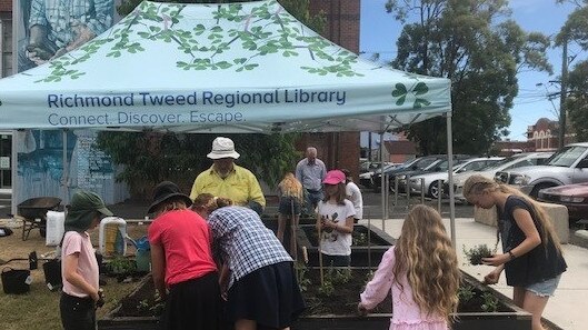 PIZZA GARDEN: Horticulturalist Tony Roden and the Lismore Garden Centre shows youngsters how to tend their pizza garden in the Quad.