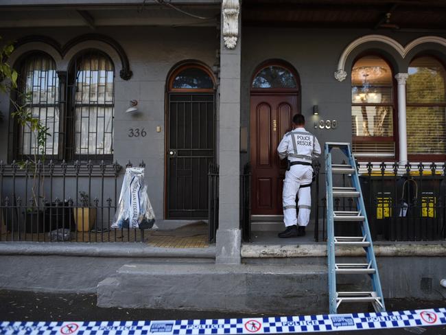 A police rescue and bomb unit officer enters an adjoining property. Picture: Darren Leigh Roberts