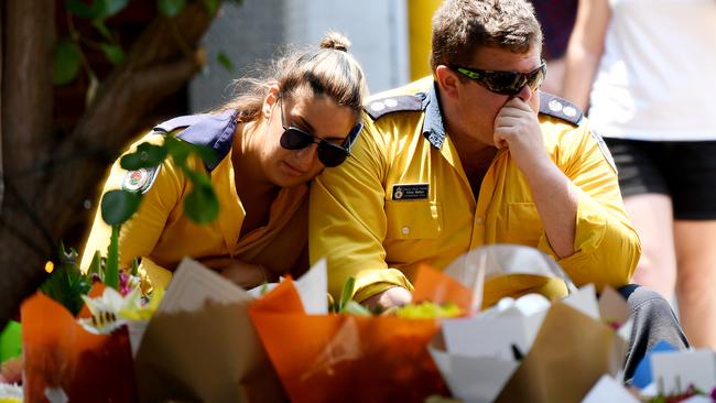 Members of the Horsley Park RFS at a memorial yesterday for their fallen colleagues.