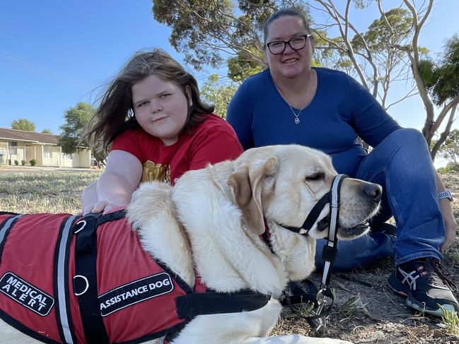 Murrianna Reese and her son Logan with his assistance dog Hunter. Picture: Dylan Hogarth