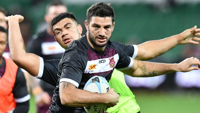 Matt Gillett (right) gets past David Fifita during training for the Queensland State of Origin team at HBF Park in Perth, Wednesday, June 19, 2019. Queensland are playing New South Wales in the 2nd State of Origin match in Perth on Sunday. (AAP Image/Darren England) NO ARCHIVING,