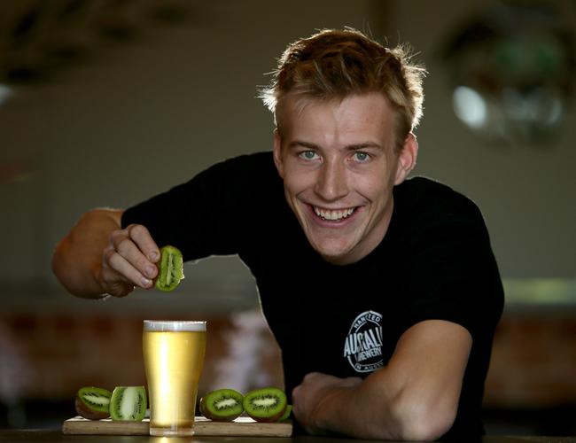 Brewer Tom Davies, pictured at the Australian Brewery in Rouse Hill, with the Kiwi fruit infused Berliner weisse. Pictures: Justin Sanson