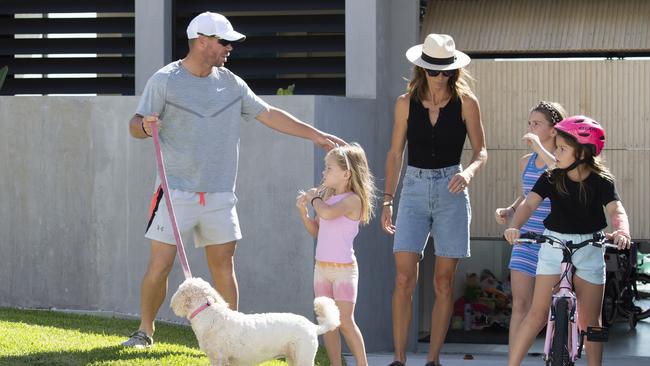 A day after retirement David and Candice Warner pictured outside their home with his daughters Ivy Mae, Indi Rae and Isla Rose in Maroubra Picture: Daily Telegraph / Monique Harmer