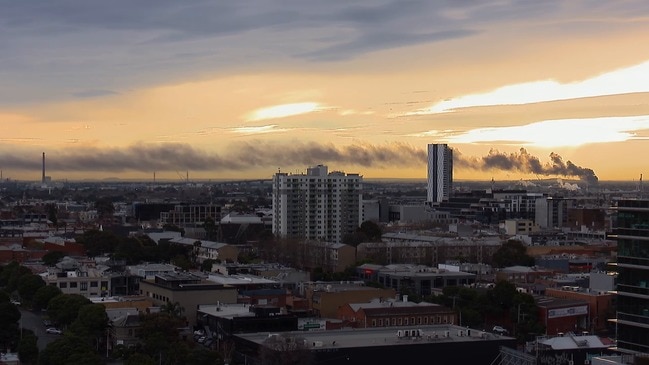 RAW: Melb factory fire smoke hangs over city sunset