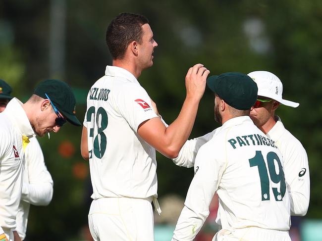 WORCESTER, ENGLAND - AUGUST 07: Josh Hazlewood of Australia is congratulated by team mates, after bowling Jack Haynes of Worcestershire LBW during the first day of the Tour Match between Worcester and Australia at Blackfinch New Road on August 07, 2019 in Worcester, England. (Photo by Matthew Lewis/Getty Images)