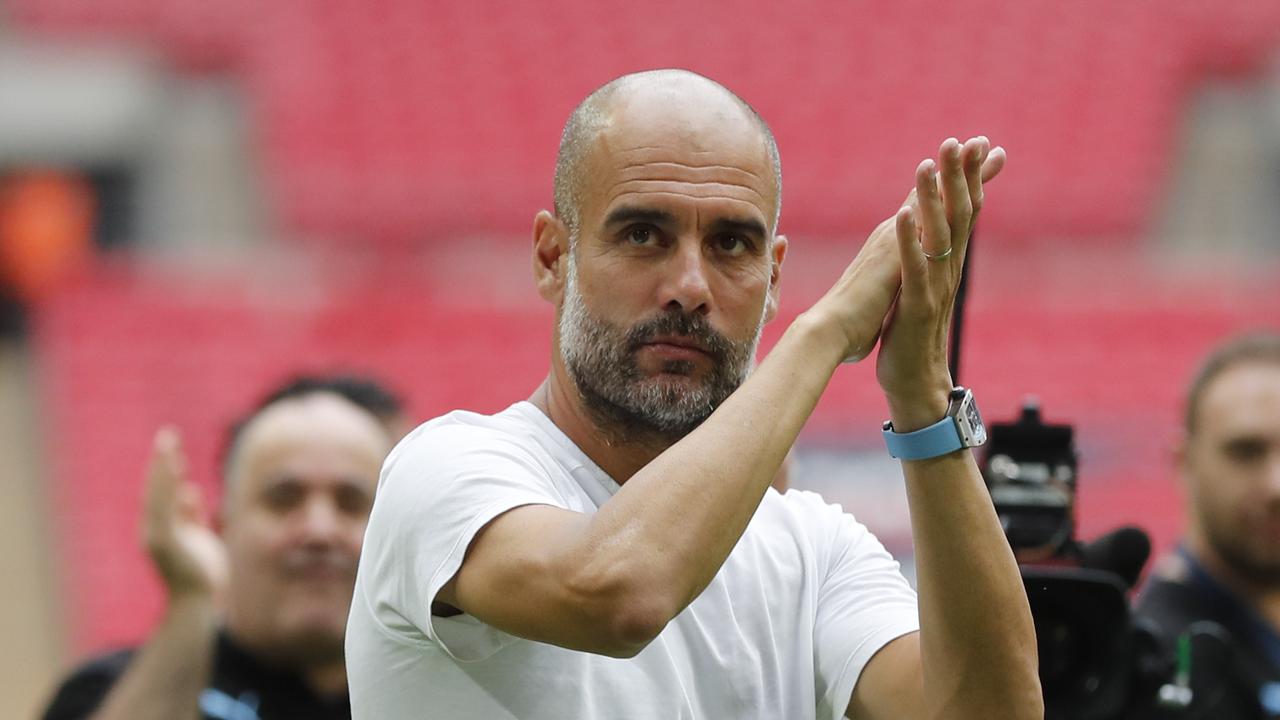 Manchester City's manager Pep Guardiola applauds fans after winning the FA Community Shield over Liverpool. (AP Photo/Frank Augstein)