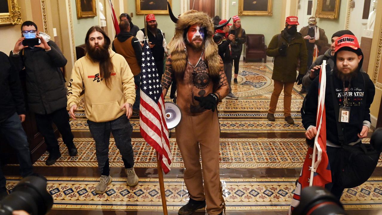 Angeli is a regular at Trump rallies and anti-Biden protests dressed up with his Davy Crockett hat and showing his Trump wall tattoos. Picture: Saul Loeb/AFP