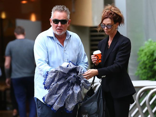 Ken and Jane Grace arrive at the Federal Court in Brisbane in 2020. Ms Grace is not accused of any wrongdoing. (AAP Image/Jono Searle)