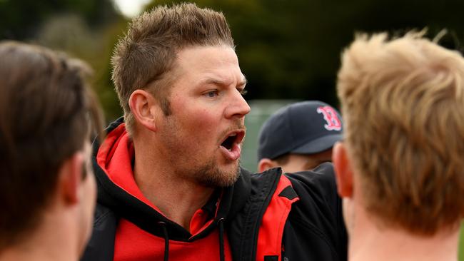 Romsey coach Justin Sherman talks to his players during the round 16 Riddell District Football Netball League 2023 Bendigo Bank Seniors match between Romsey and Macedon at Romsey Park in Romsey, Victoria on August 5, 2023. (Photo by Josh Chadwick)