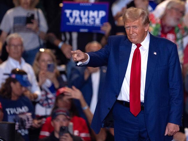 TOPSHOT - Former US President and Republican presidential candidate Donald Trump acknowledges the crowd during a campaign rally in Uniondale, New York, on September 18, 2024. (Photo by David Dee Delgado / AFP)