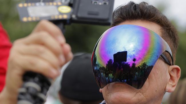 TORREON, MEXICO - APRIL 8: A man watches the eclipse on April 8, 2024 in Torreon, Mexico. Millions of people have flocked to areas across North America that are in the path of totality in order to experience a total solar eclipse. During the event, the moon will pass in between the sun and the Earth, appearing to block the sun.(Photo by Getty Images/Getty Images)