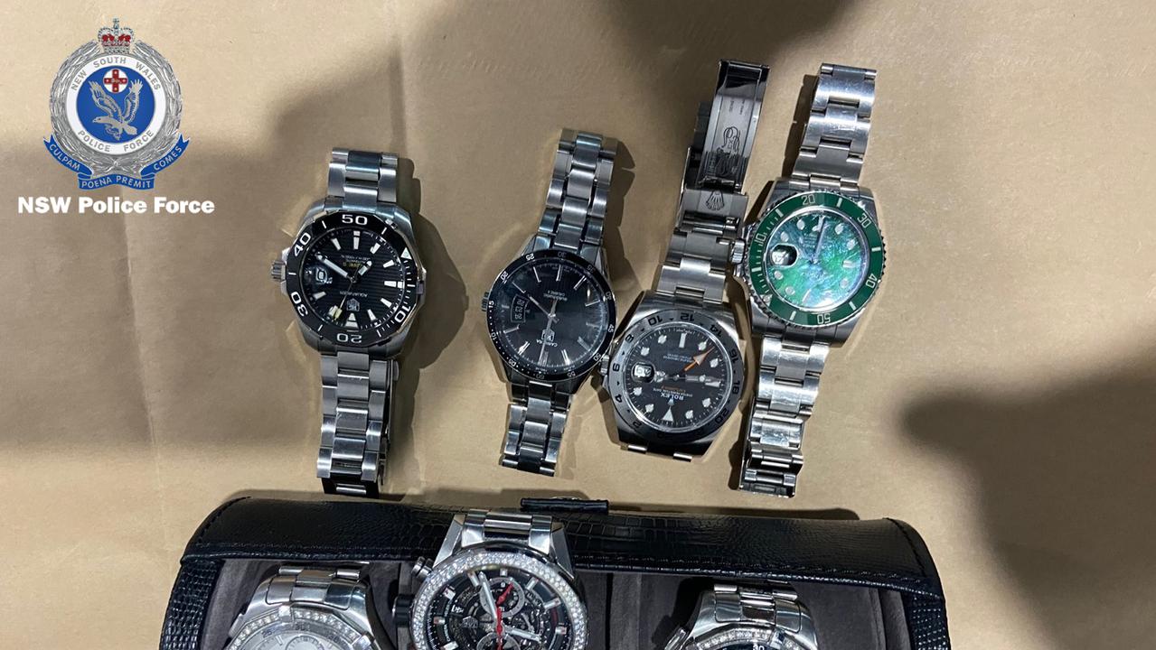 Police seized designer watches and thousands of dollars in cash during raids of bikie residences across Sydney. Picture: NSW Police