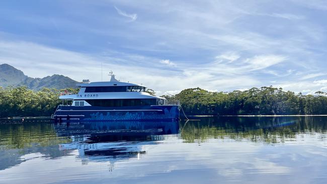 The luxury cruise vessel Odalisque III, reflected in the stillness at Bathurst Harbour, can accommodate 12 guests. Port Davey cruise, Tasmania. Picture: Philip Young