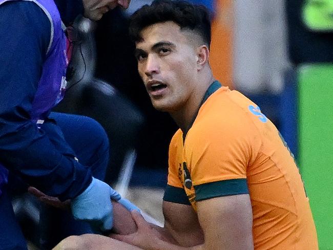 EDINBURGH, SCOTLAND - NOVEMBER 24: Joseph-Aukuso Suaalii of Australia reacts as he receives medical treatment after sustaining an injury, before later leaving the field, during the Autumn Nations Series 2024 match between Scotland and Australia at Scottish Gas Murrayfield on November 24, 2024 in Edinburgh, Scotland. (Photo by Stu Forster/Getty Images)