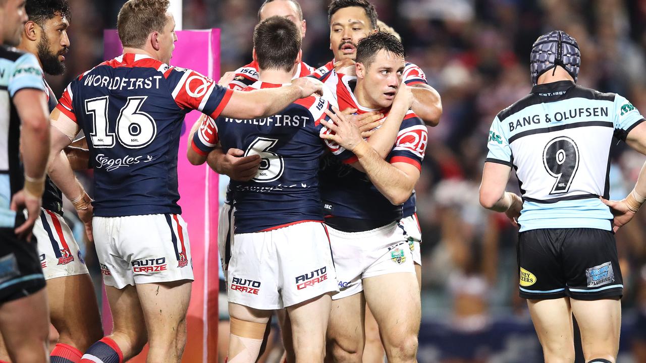 Cooper Cronk celebrates as the Roosters ran out winners over the Sharks.