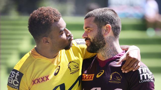 Ezra Mam showing some love for Adam Reynolds at Broncos training. Picture: Liam Kidston