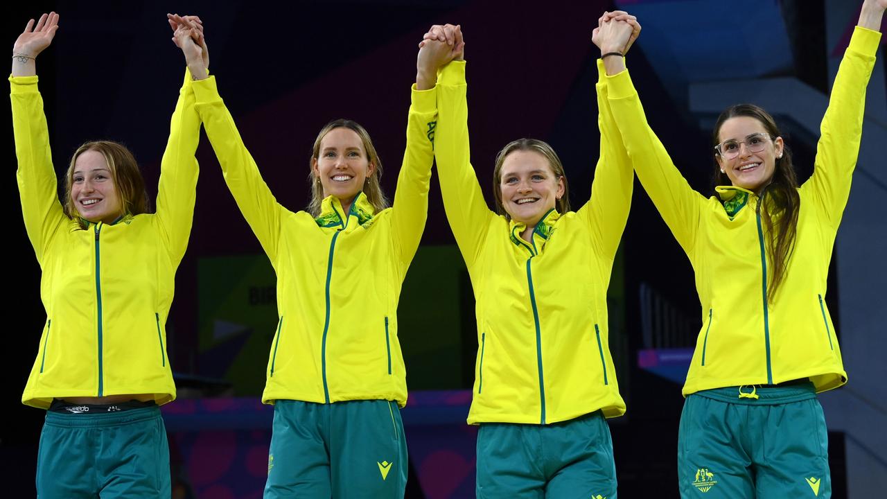 Australia sits on top of the medal table after week one of the Birmingham Commonwealth Games. Gold medallists Chelsea Hodges, Emma McKeon, Mollie O'Callaghan and Kaylee McKeown celebrate during the medal ceremony for the Women's 4x100m Medley Relay final on day six, the last race in the pool. Picture: Quinn Rooney/Getty Images