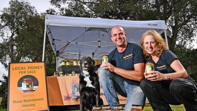 Jens and Lisa Roestel with Ben the dog for Black Dog Honey. New farmers market in Robina. Friday May 24, 2024. Picture, John Gass