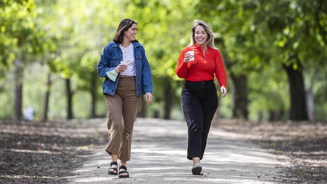 Enjoying a walk in the park … Zoe Harbison and Bronte Tarn-Weir stroll through Alma Park in Melbourne’s inner-city St Kilda. Picture: Aaron Francis