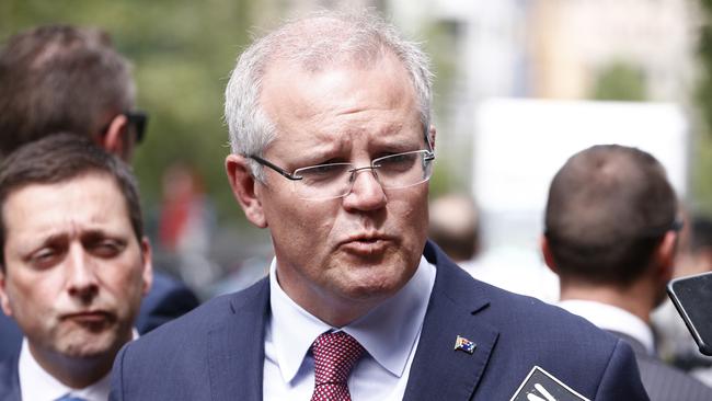 Prime Minister Scott Morrison speaks to the media on Bourke Street near Pellegrini's Espresso Bar when it re-opened to the public after the death of Sisto Malaspina.