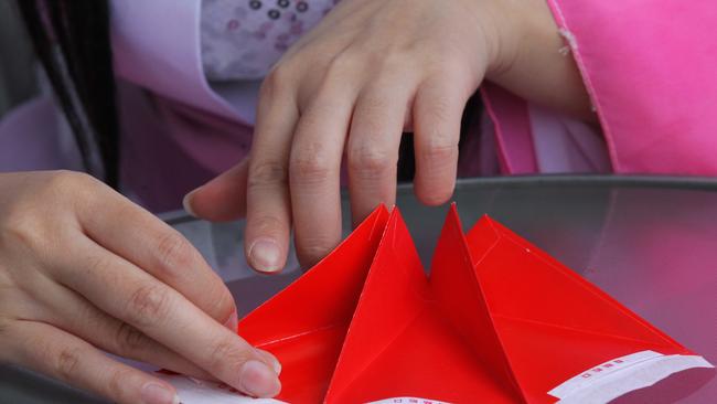 News Queensland BSM lanterns from traditional red envelopes. Minnie Sheng and Jenny Chen.