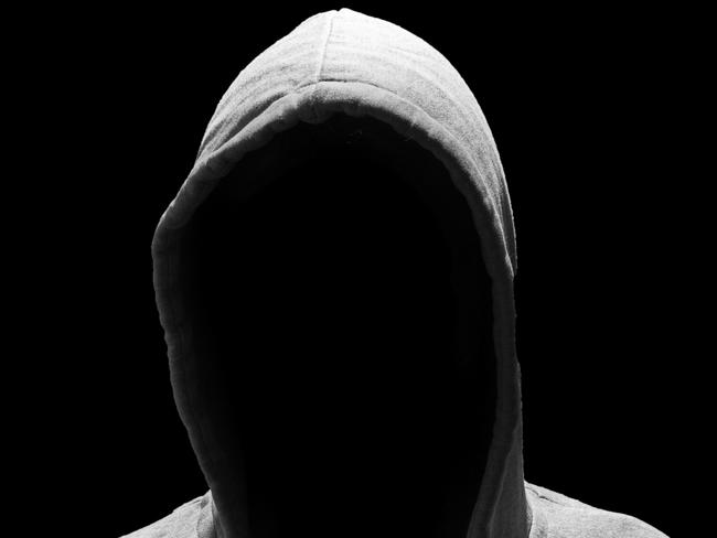 Portrait of Invisible man in the hood isolated on black background creep pervert molestor generic Photo: iStock