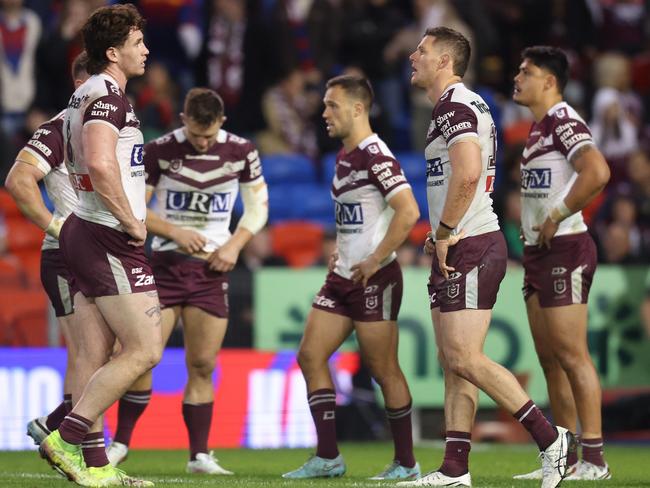 Manly players react after losing the golden point thriller. Picture: Scott Gardiner/Getty Images