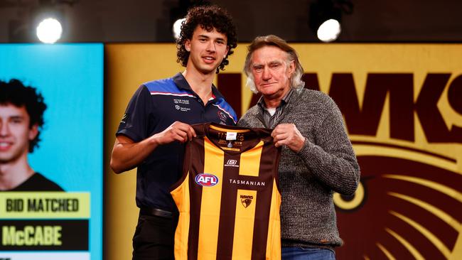 MELBOURNE, AUSTRALIA – NOVEMBER 20: William McCabe is seen with Michael Tuck after being selected at number 19 by Hawthorn during the 2023 AFL Draft at Marvel Stadium on November 20, 2023 in Melbourne, Australia. (Photo by Michael Willson/AFL Photos via Getty Images)