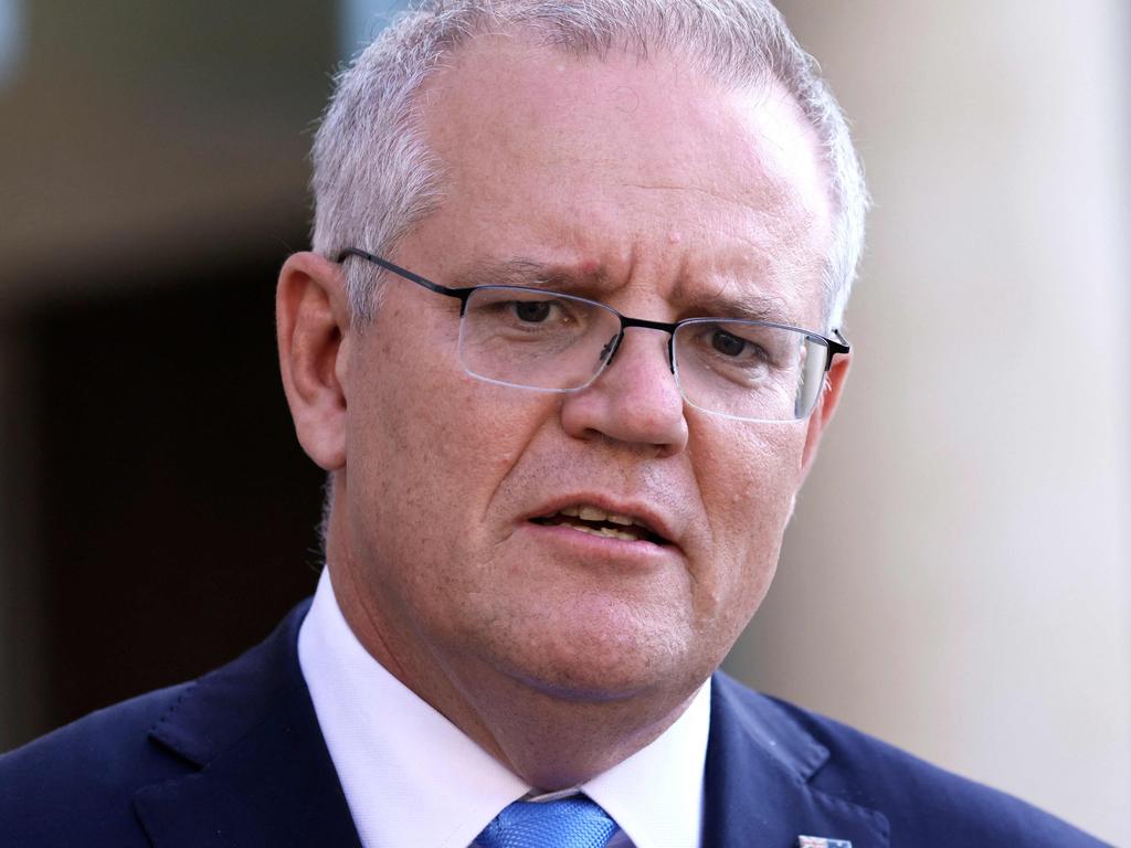 Prime Minister Scott Morrison has announced Australia’s overseas passenger intake will be cut by half due to concerns over the Delta variant. Picture: Thomas Samson / AFP