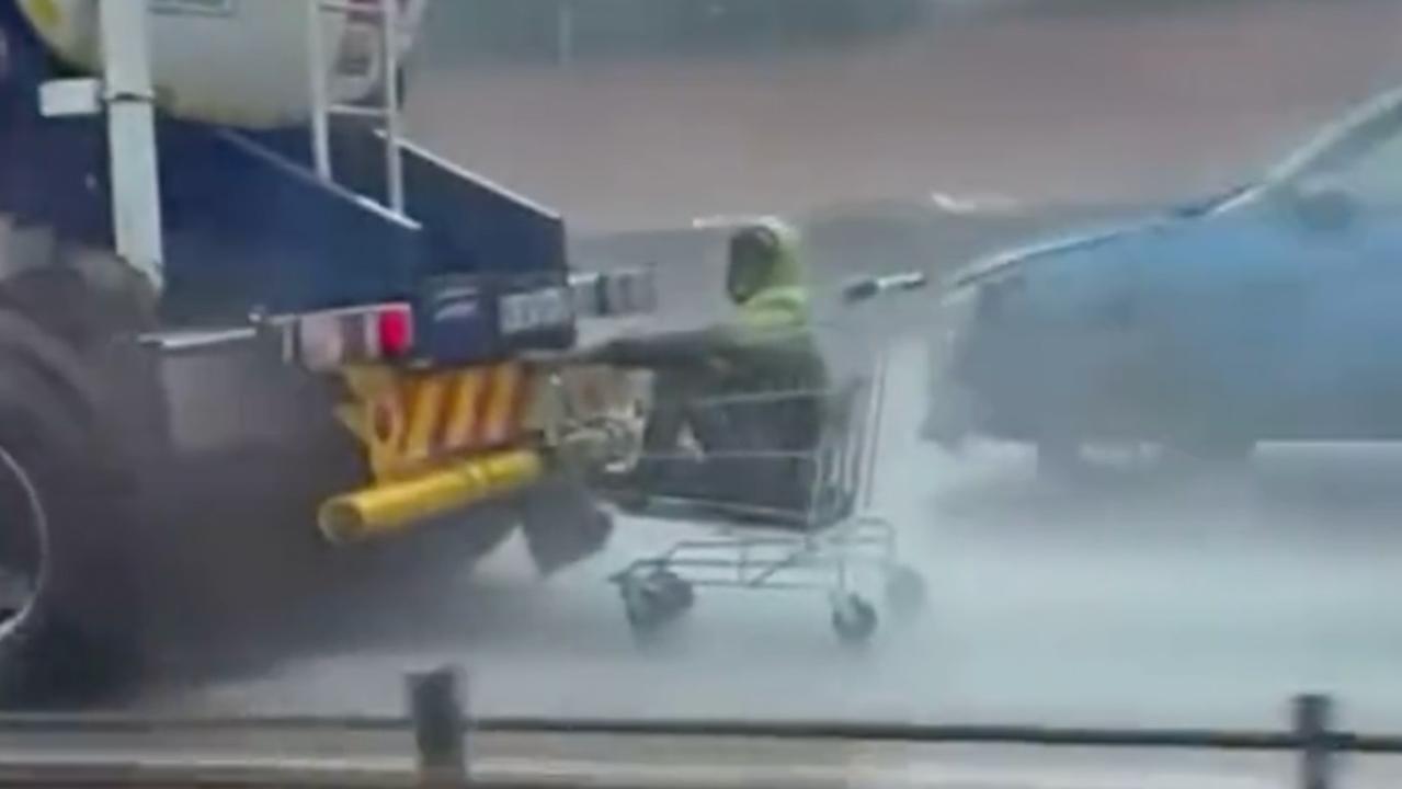 This man clung to a moving truck from inside a supermarket trolley. Picture: Twitter/bramjee