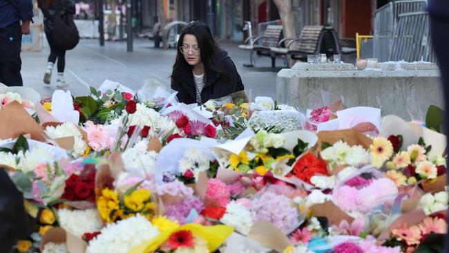 Hundreds of flowers pay tribute to the victims. Picture: NCA NewsWire / Rohan Kelly