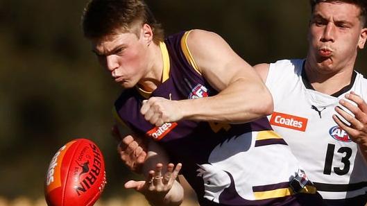 MELBOURNE, AUSTRALIA - SEPTEMBER 03: Joshua Walker of the Chargers handballs under pressure from Kristian Ferronato of the Knights during the Coates Talent League Boys Wildcard Round match between Northern Knights and Oakleigh Chargers at La Trobe University Sports Fields on September 03, 2023 in Melbourne, Australia. (Photo by Daniel Pockett/AFL Photos/via Getty Images)