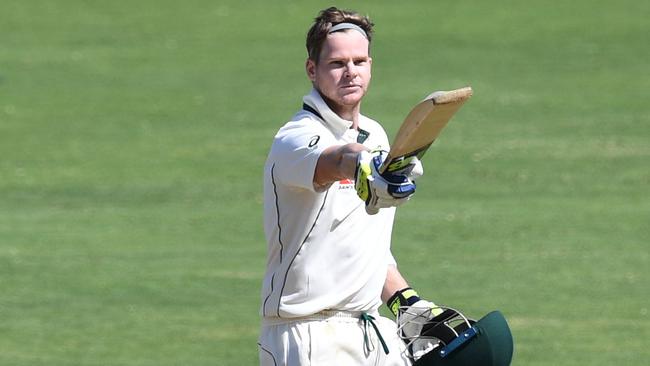 Steve Smith celebrates after scoring a century against India in Pune in 2017. Picture: AFP