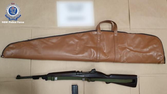 Police allege the former NSW Police Force civilian employee handled an M1 carbine semi-automatic rifle and an air rifle. Picture: NSW Police Media