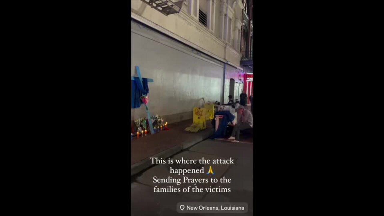 Memorial With Cross and Candles Appears at Site of New Orleans Attack