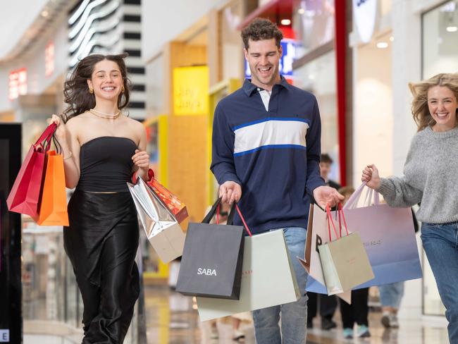 Ashley Bassy, James Chapman and Sidney Delaney shopping at  Chadstone Shopping Centre to promote Black Friday shopping day. Picture: Tony Gough