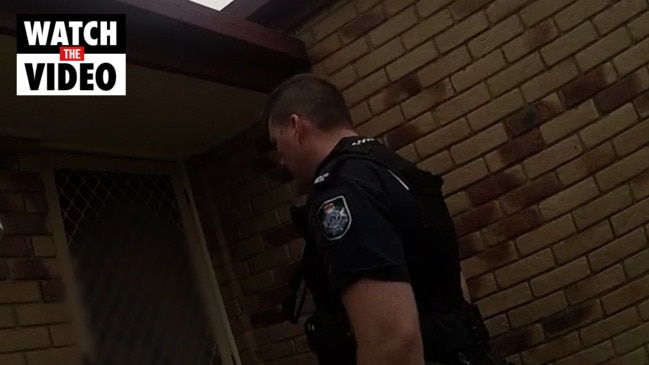 Police take people into custody during a domestic violence blitz