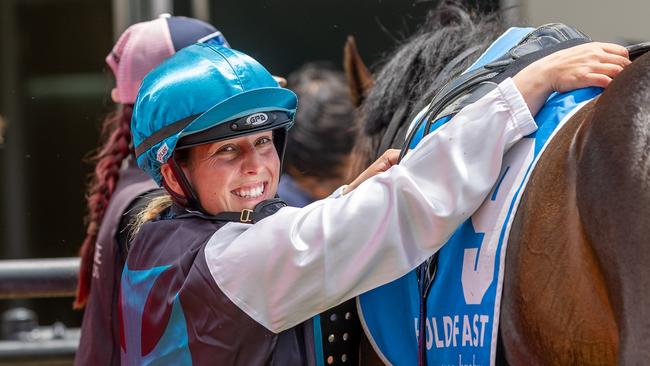 Apprentice jockey Chelsey Reynolds unsaddles after a winner. Picture: Makoto Kaneko