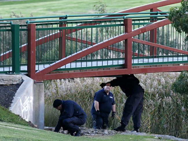 Forensic crews search under a bridge near the house in the northern suburbs in relation to alleged terror plot.
