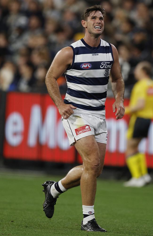 Tom Hawkins limping off the MCG. Picture: Michael Klein