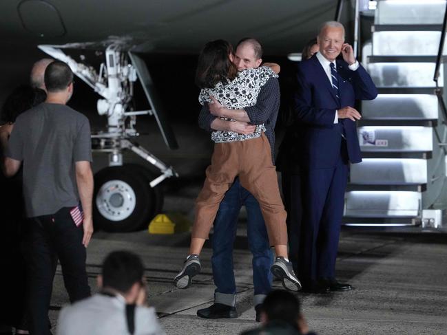 Evan Gershkovich embraces his mother Ella Milman in a huge hug. Picture: AFP