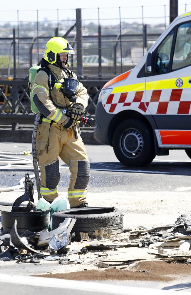 Members of the public helped emergency services tyring to get people out of their damaged cars. Picture: NewsWire / John Appleyard