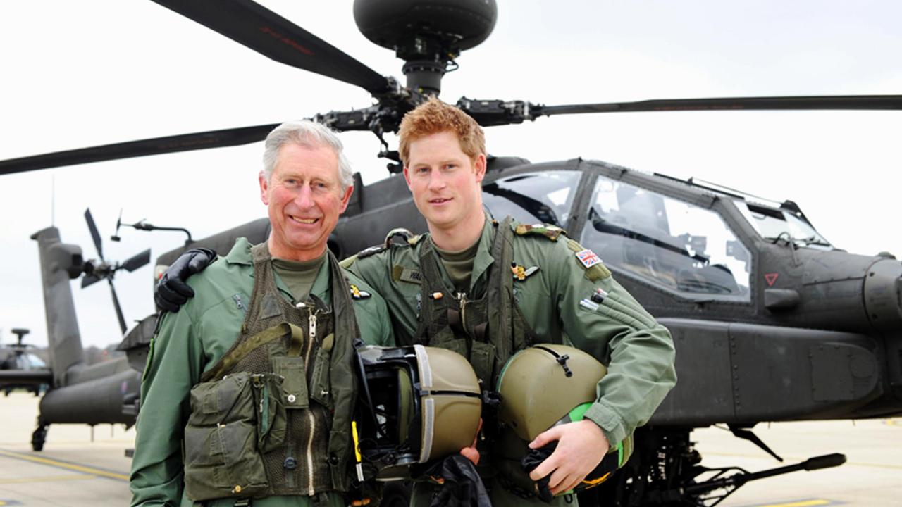 Prince Harry and his father, the Prince Charles, Prince of Wales, in front of an Apache Helicopter in 2011. Picture: Richard Dawson/MoD via Getty Images