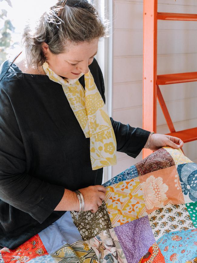 Sarah Stamm of Salisbury and Maude with her new quilt designs.