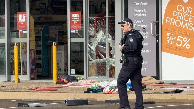 Seven shopfronts were found smashed up at Domain Central in Townsville on Friday morning. Picture: Natasha Emeck