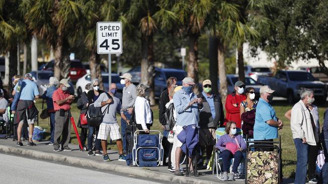 Seniors and first responders wait in line to receive a COVID-19 vaccine in Fort Myers, Florida. Picture: AFP.