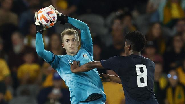 MELBOURNE, AUSTRALIA - MARCH 28: Socceroos goalkeeper Joe Gauci looks to pass the ball under pressure from Kevin Rodriguez of Ecuador during the International Friendly match between the Australia Socceroos and Ecuador at AAMI Park on March 28, 2023 in Melbourne, Australia. (Photo by Daniel Pockett/Getty Images)
