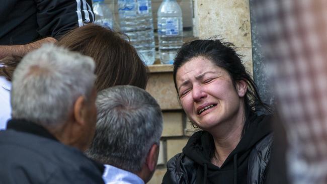 A woman cries outside a hospital. Picture: Visar Kryeziu